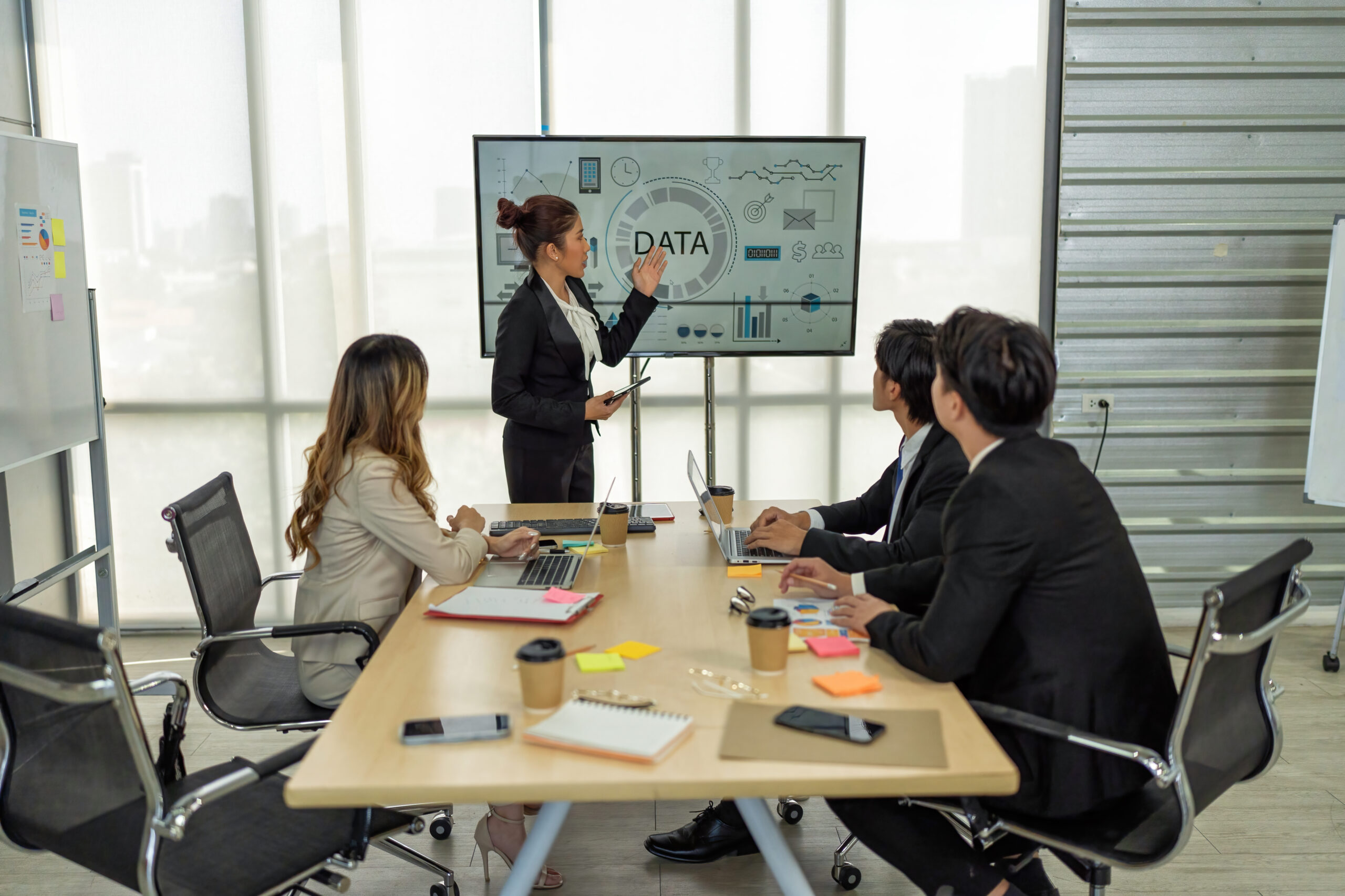 Employee meeting big screen tv presentation conference discussion brainstorming and working together